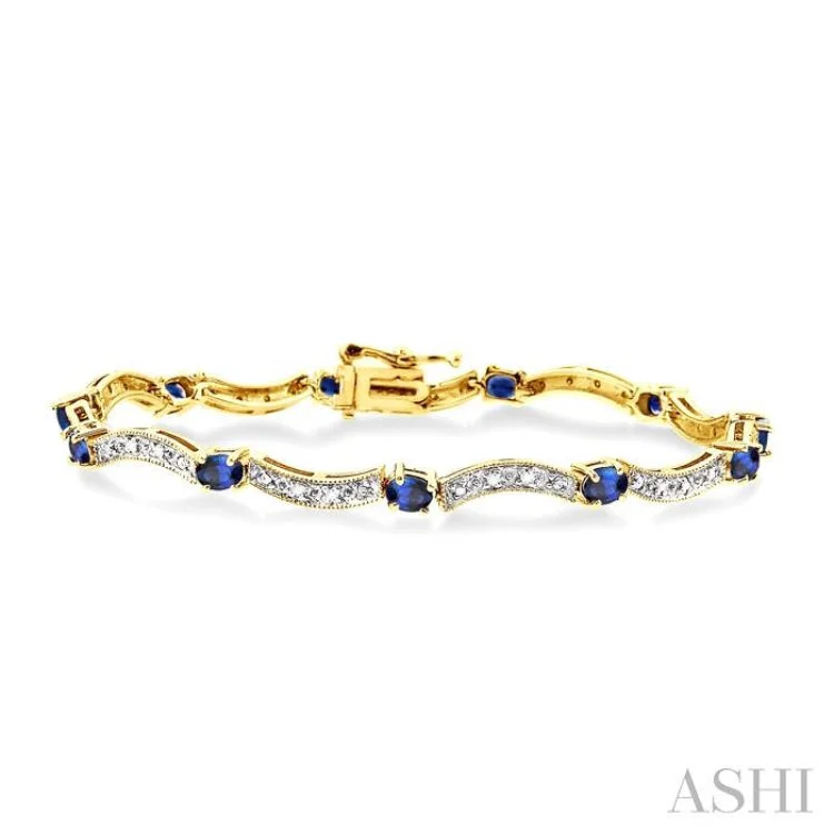 4x3mm Oval Cut Sapphire and 1/10 Ctw Single Cut Diamond Bracelet in 14K Yellow Gold