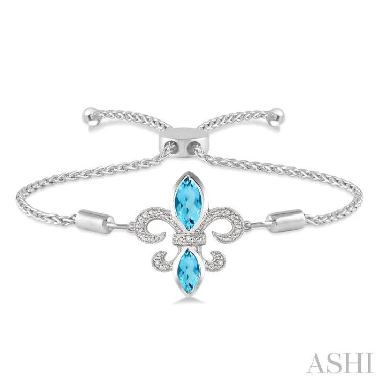 1/20 Ctw Round Diamond and Marquise 10x5mm & 8x4mm Blue Topaz Fleur De Lis Sterling Silver Lariat Bracelet